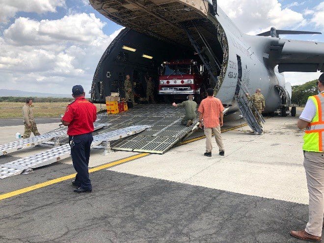  A donated firetruck is offloaded for use by the Boberos de Esteli, a firefighting organization from the northern, mountainous area of Nicaragua. The Wisconsin National Guard helps support Denton Flights – an aid program that uses U.S. military aircraft on a space available basis to transport relief supplies, as part of its State Partnership Program with Nicaragua.  Photo taken and submitted by Army 2nd Lt. Ellie Tadych.