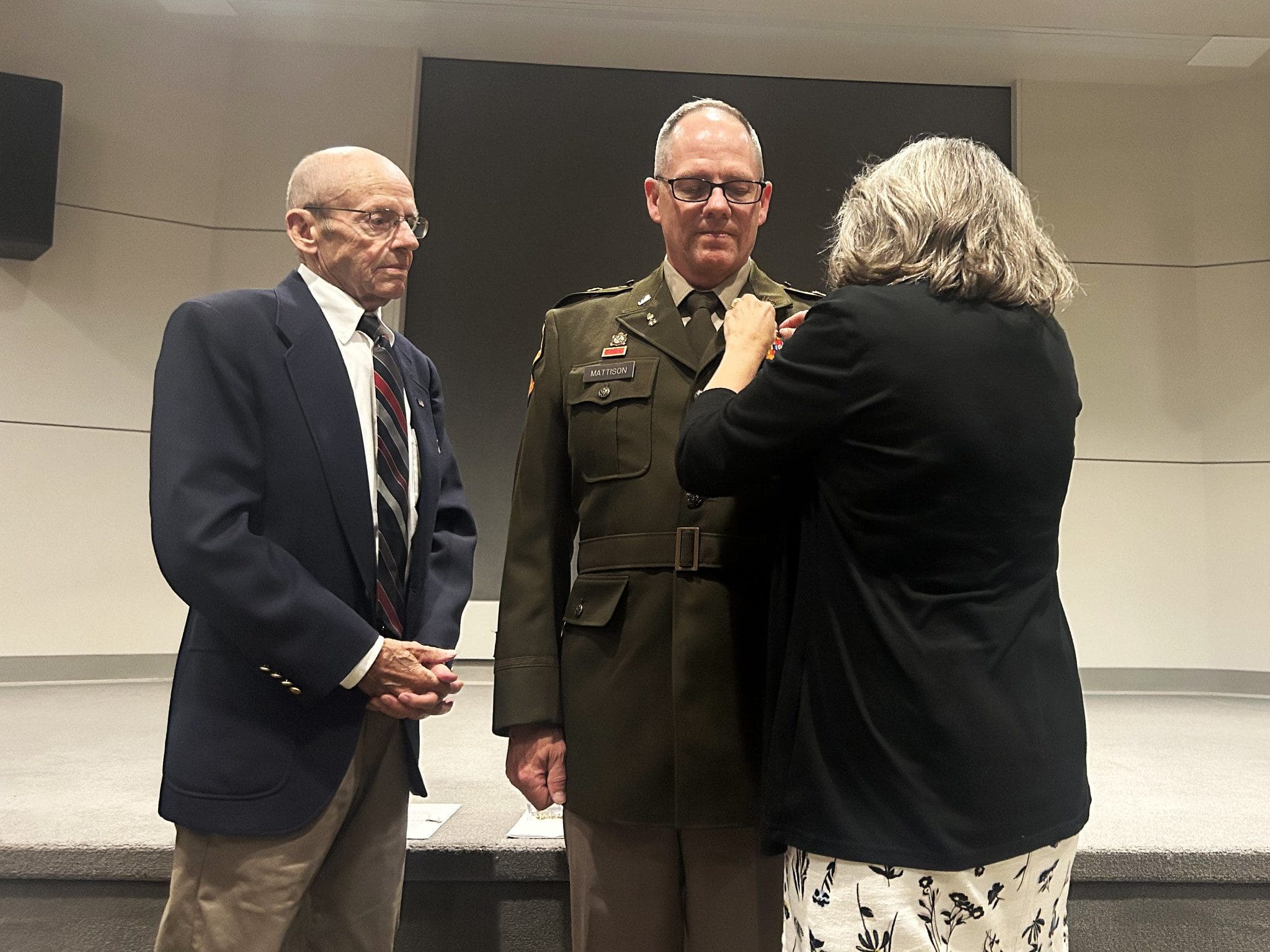Command Chief Warrant Officer Charles Mattison has chief warrant officer 5 rank pinned on by his father Michael and wife Kathy during a July 12 promotion ceremony at Joint Force Headquarters’ Witmer Hall in Madison, Wis. Wisconsin National Guard photo by Staff Sgt. Alice Ripberger