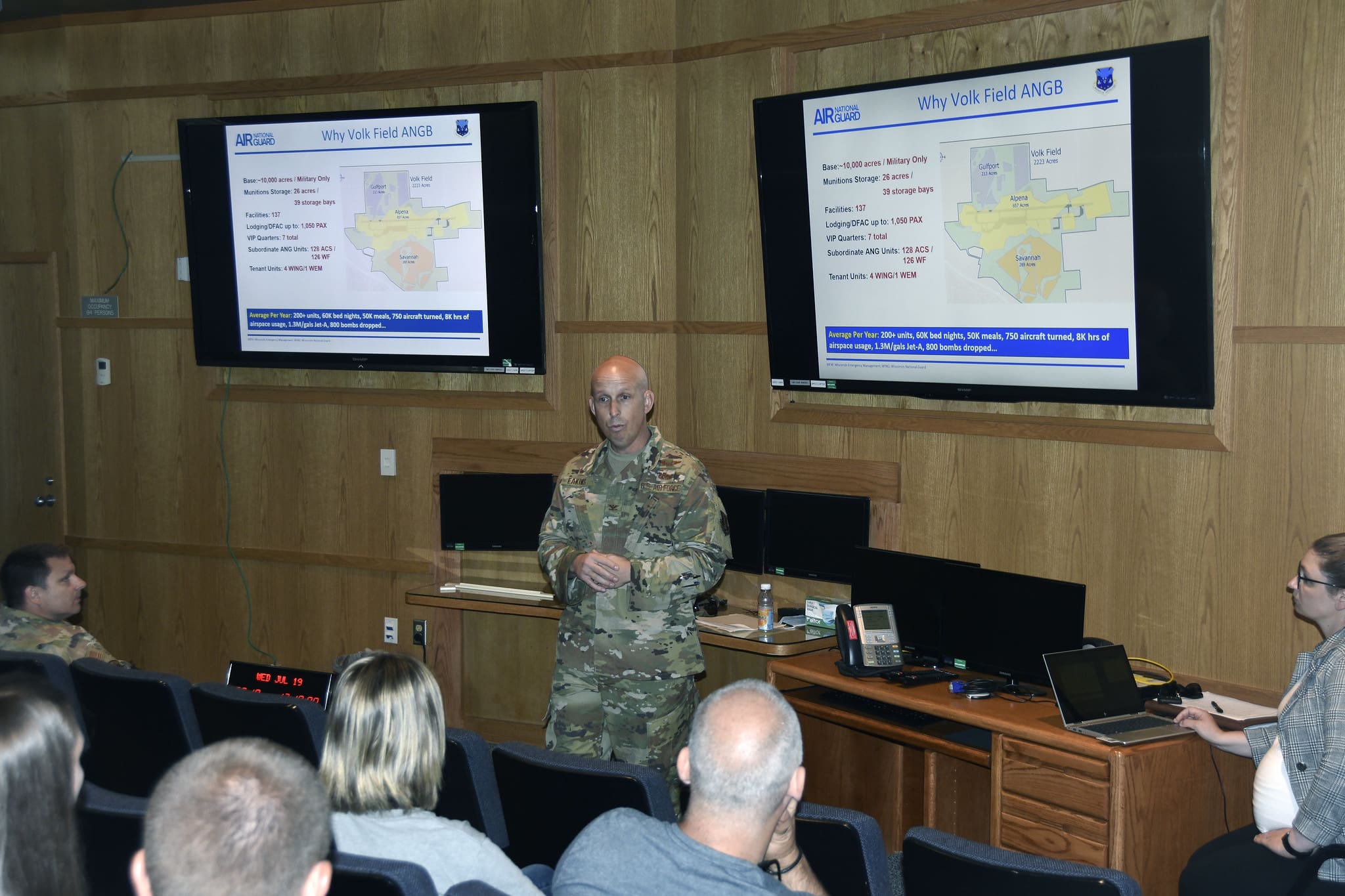 Col. Matthew Eakins, commander of Volk Field Air National Guard Base, briefs approximately 30 educators from 23 schools during a civic leader flight July 19. The event gave educators a better understanding of the career opportunities available in the Wisconsin Air National Guard. Wisconsin Department of Military Affairs photo by Kelly Bradley