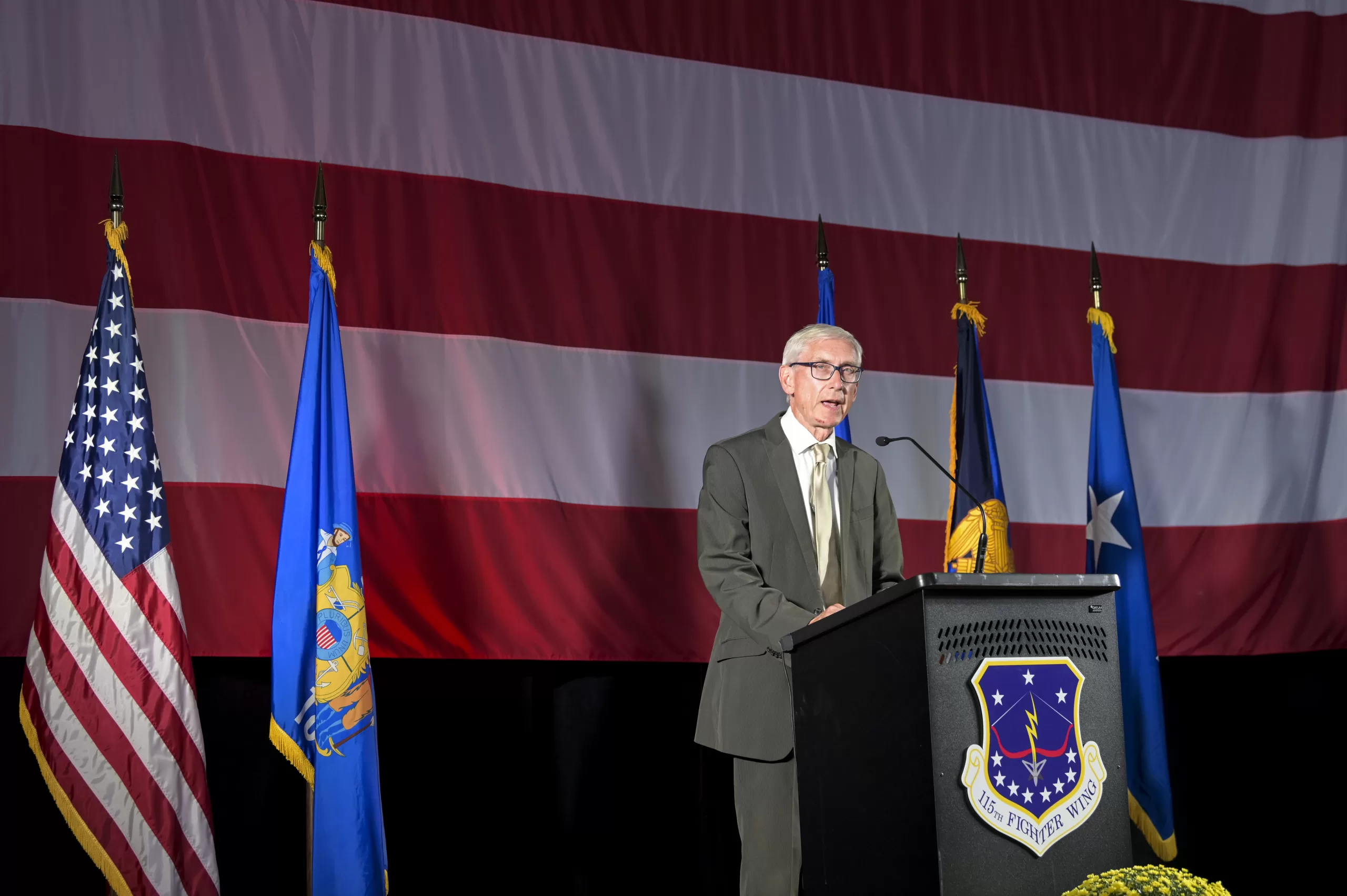 Gov. Tony Evers speaks during a Sept. 7 ceremony at the Wisconsin Air National Guard’s 115th Fighter Wing in Madison, Wis., to commemorate the fighter wing formally accepting the F-35 Lightning II mission. The 115th is only the second Air National Guard to field the 5th-generation fighter jet. 115th Fighter Wing photo by Tech. Sgt. Cameron Lewis