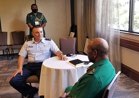Maj. Gen. Paul Knapp, Wisconsin’s adjutant general (center), speaks with Maj. Gen. Maj. Gen. Gilbert Toropo, the Papua New Guinea Chief of Defense (center right), in September 2021 in Hawaii. Knapp visited Hawaii to meet with Toropo and attend a series of conferences in conjunction with the Wisconsin National Guard’s partnership with Papua New Guinea through the State Partnership Program. Submitted photo